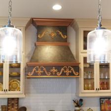 Kitchen cabinets paint and faux copper stove hood